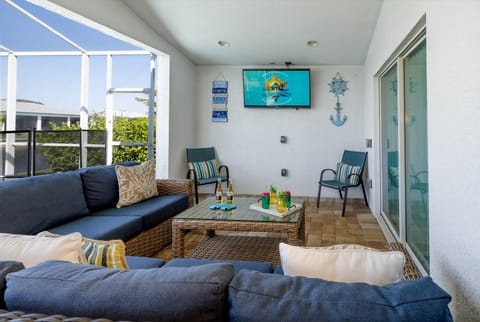 Relaxation Hub - - Unwind on the comfortable sectional while watching your favorite shows on the wall-mounted smart TV
- Charming nautical decor adds a fun, coastal vibe to the space
- Perfect spot for casual hangouts or quiet moments by the poolside
