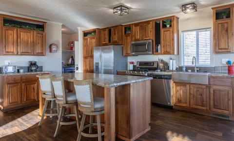 Kitchen with the laundry room right off it with entry into the home.
