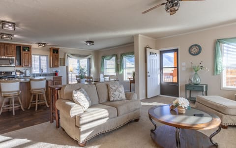 A comfortable and stylish great room with front balcony access