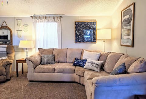 Living Room: Welcome to our cozy home featuring an open-layout living space with comfy seating and a well-equipped kitchen - perfect for relaxation or entertaining.