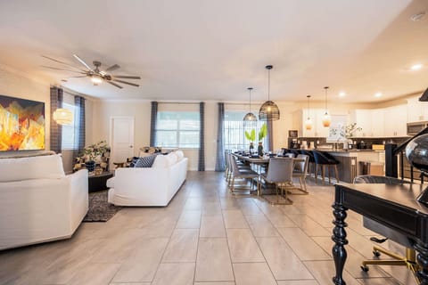 Experience luxury in this expansive living and dining area, perfect for gatherings and relaxation.