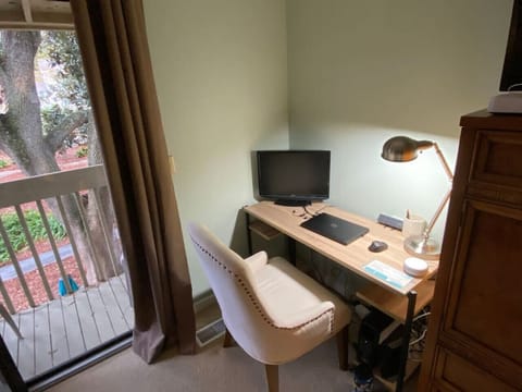 Work remotely with ease! Enjoy a dedicated desk, external monitor, and high-speed internet—all with a peaceful balcony view.