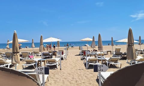 Beach umbrellas, beach towels, kayaking