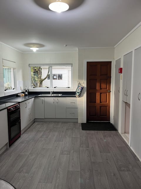 Two Bedroom Unit with Courtyard | Private kitchen | Shared fridge, microwave, highchair