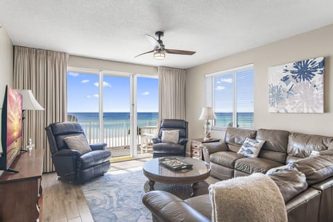 This 3BR/3 BA updated condo features a bright and open living and dining space with tall ceiling, Gulf views, and plenty of seating around a large Smart TV for all your streaming needs.