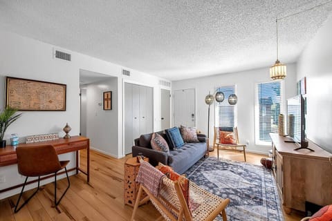 Cute Open Living Space with Smart TV and workspace