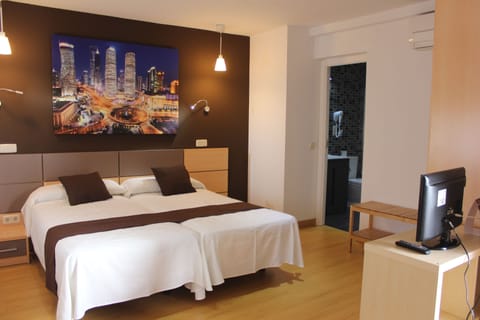Standard Triple Room, Private Bathroom | Blackout drapes, iron/ironing board, free cribs/infant beds, free WiFi