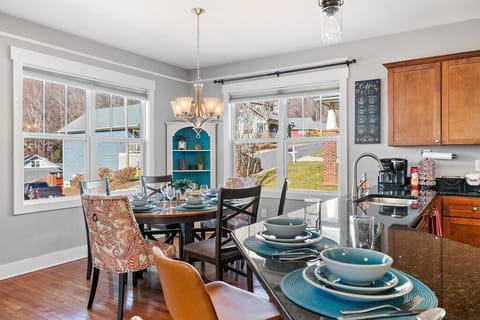 The dining table seats 6 with 2 additional seats at the kitchen island