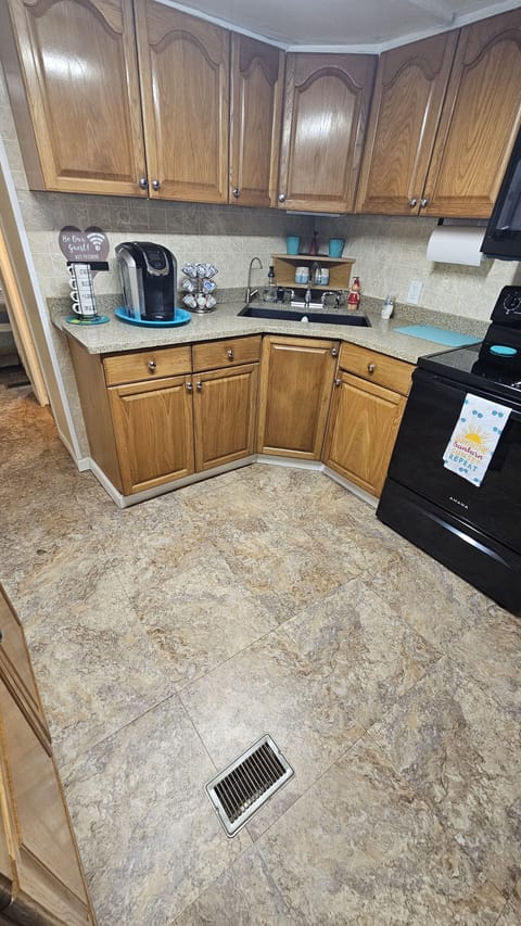 Kitchen, Keurig to the left,sink in front and over to right