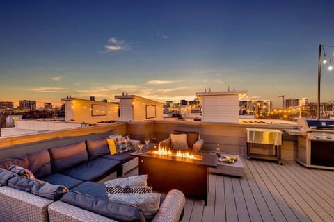 4th Floor: Private rooftop patio with outdoor seating, fire pit, BBQ grill, and amazing city views.