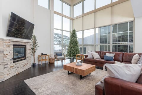 Boasting a comfortable living room with a spacious sectional couch, a cozy gas fireplace, and a smart TV, this space is perfect for relaxing and unwinding after a day of adventures.