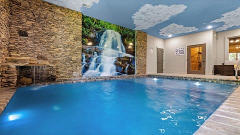 Smoky Mountains rental cabin with private indoor swimming pool and waterfall.