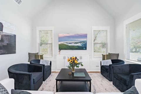 White Retreat has comfortable and cozy seating for 7 in the living room plus more on the benches.