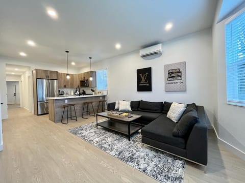 Living area seamlessly blends with a countertop-turned-island.