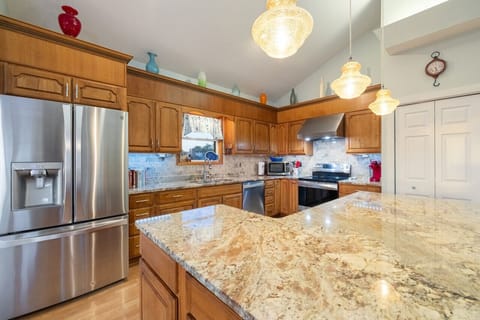 Kitchen upstairs with large granite island