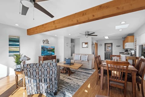 Dining Area: Gather around the dining table for a meal or enjoy a show on the TV in our open-concept living space.
