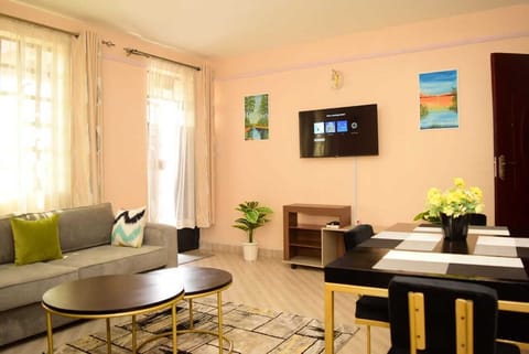 Business Apartment | Living area | 24-inch Smart TV with satellite channels