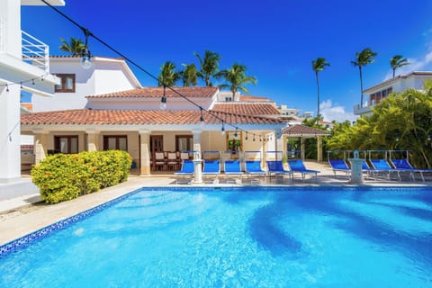 Enjoy outdoor living with a BBQ, swimming pool, sun lounges, and a dining area.