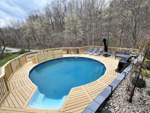 With loungers, sofa, loveseat, chairs, pool edge bar seating and10x10 umbrella. 