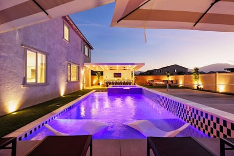 Evening Serenity by the Pool with Colorful Lights and Modern Outdoor Lounge – Perfect for Relaxation and Entertaining!