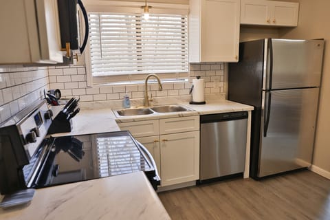 Updated kitchen with new cabinets and countertops and stainless appliances
