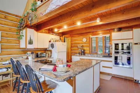Fully equipped log side kitchen for cooking, baking, & shared meals. (kitchen 1)