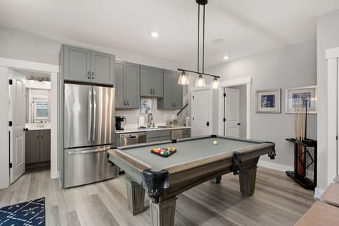 Modern kitchen w/ stainless appliances, center island & space to cook together.