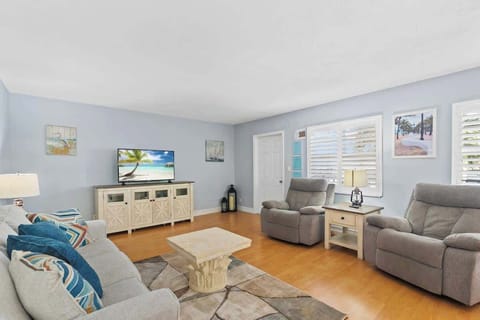 Bright, cozy living room with coastal accents.
