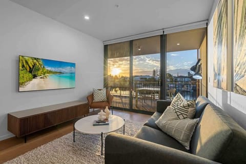 Floor-to-ceiling windows flood the area with natural light