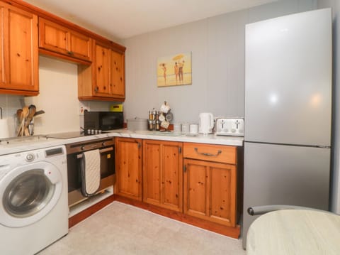 Fridge, electric kettle, toaster, cookware/dishes/utensils