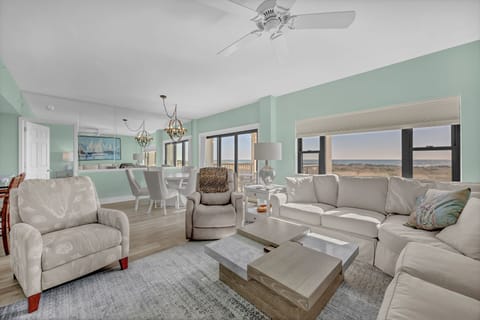 Relax in your bright, airy living space with plush seating and stunning windows framing scenic views—perfect for unwinding after your adventures.