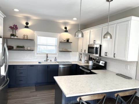 Full kitchen, seats 4 at counter, large walk in pantry, stand alone ice maker.