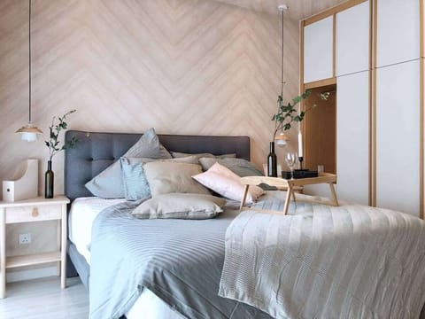 A master bedroom with a king sized bed & an en-suite.