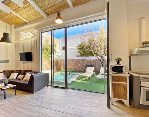 Living room, garden, and pool area