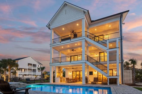 Three-story beach house with private pool at Vistas Del Sol, a 5-bedroom Tilghman Beach rental from Thomas Beach Vacations