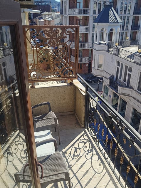 Standard Double Room, Balcony, City View | Living area | Flat-screen TV, printers