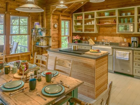 Open configuration lets everyone be together whether cooking eating, doing work on the porch or lounging by the fire