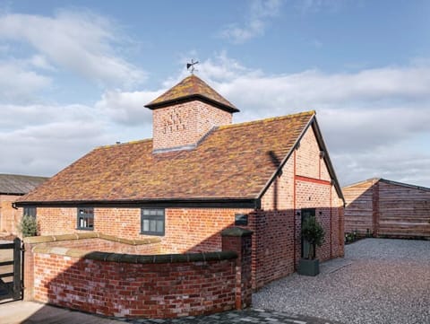Pigeon House from the front, showing parking for two vehicles at the back