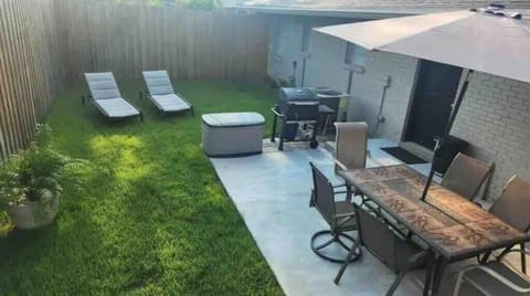 Private fenced living area. Grill , chairs 6, umbrella, Lounge chairs 2 , Yard