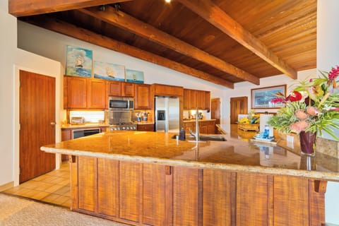Chef's kitchen with Koa Wood Cabinets Chef's kitchen with custom Koa Wood Cabinets