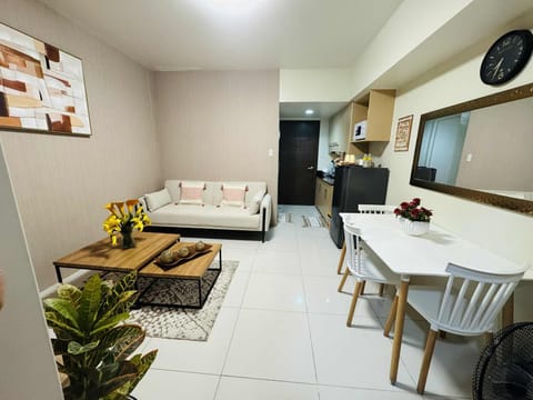 Business Condo | Living area | 55-inch LCD TV with digital channels, Netflix, streaming services