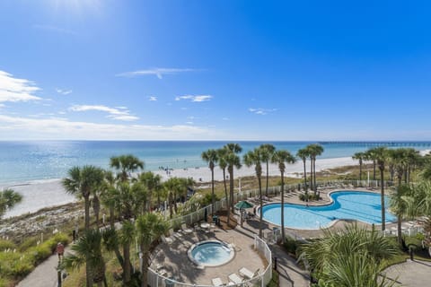 Relax by the pool with direct views of the beach and ocean.