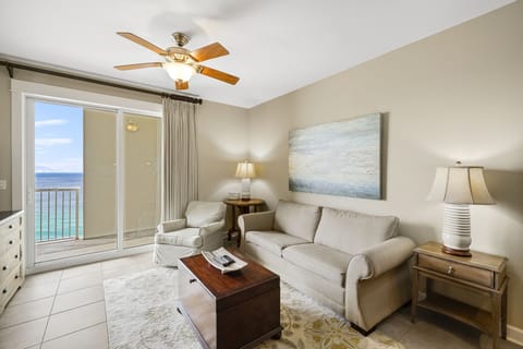 Relax in this bright living room with ocean views and comfortable seating.