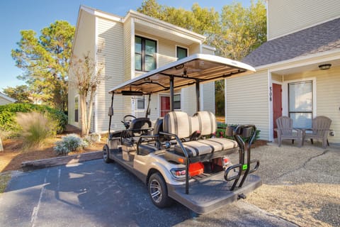 Modern vacation rental with convenient golf cart for easy neighborhood exploration and beachside adventures.