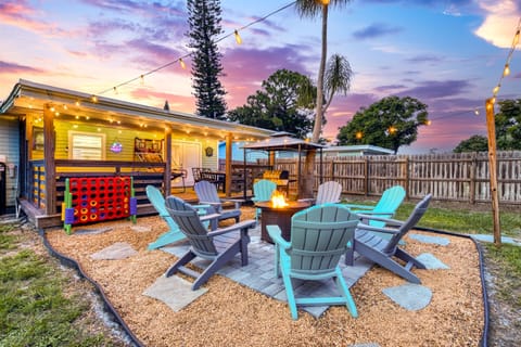 Experience outdoor bliss on our inviting covered patio! Gather around the gas fire pit in cozy Adirondack chairs for warm evenings under the stars, or fire up the propane grill for a delicious outdoor meal!