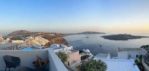 Panoramic volcano, caldera and Fira view from the balcony