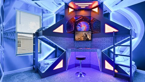 This delightful kids' room is designed to spark imagination and provide a comfortable space for children. 