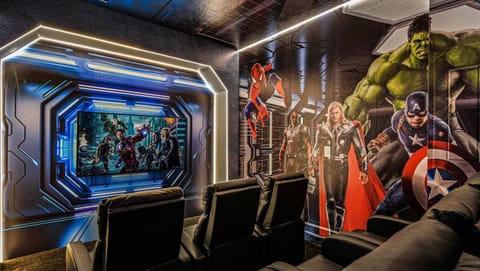 Epic Marvel-themed home theater with luxury seating for unforgettable movie nights.