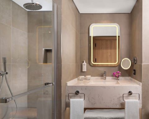 Shower, rainfall showerhead, designer toiletries, hair dryer