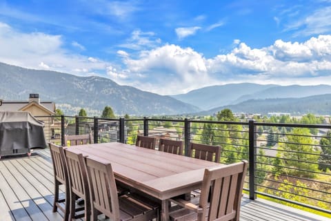 Gather around this spacious outdoor dining table and take in stunning mountain vistas—your private deck offers fresh air, majestic peaks, and the perfect backdrop for memorable meals under open skies.